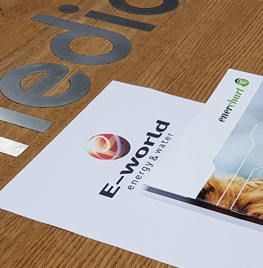 Picture of e-world flyer with enerchart booklet on top